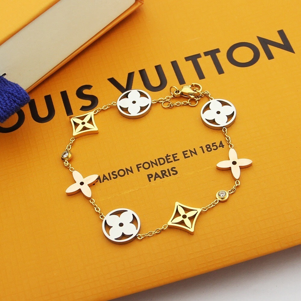 GOLD-TONE MULTI CHARM FLOWER MOTIF BRACELET