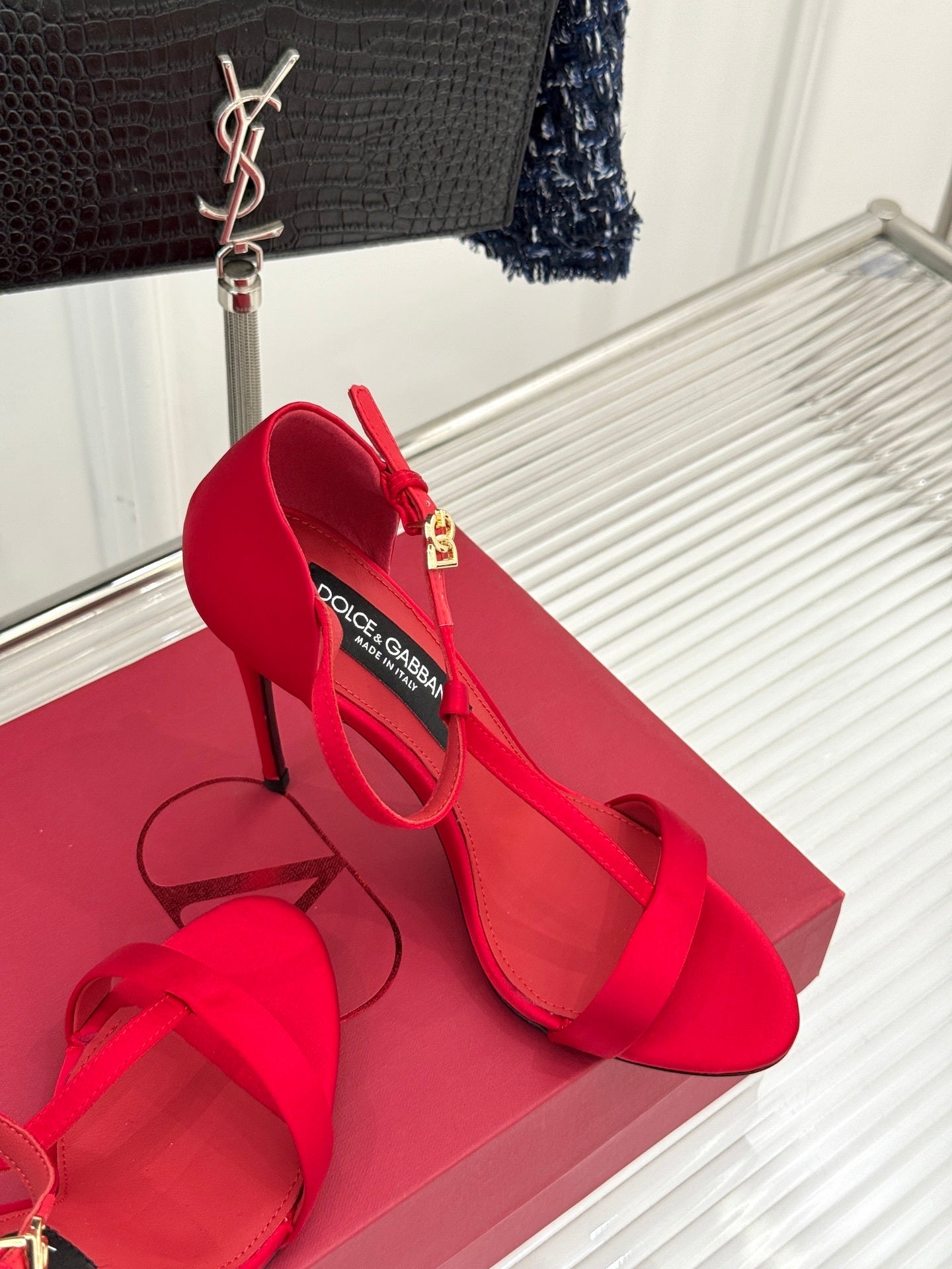 BOLD RED STRAPPY HEEL SANDALS WITH STATEMENT SILHOUETTE