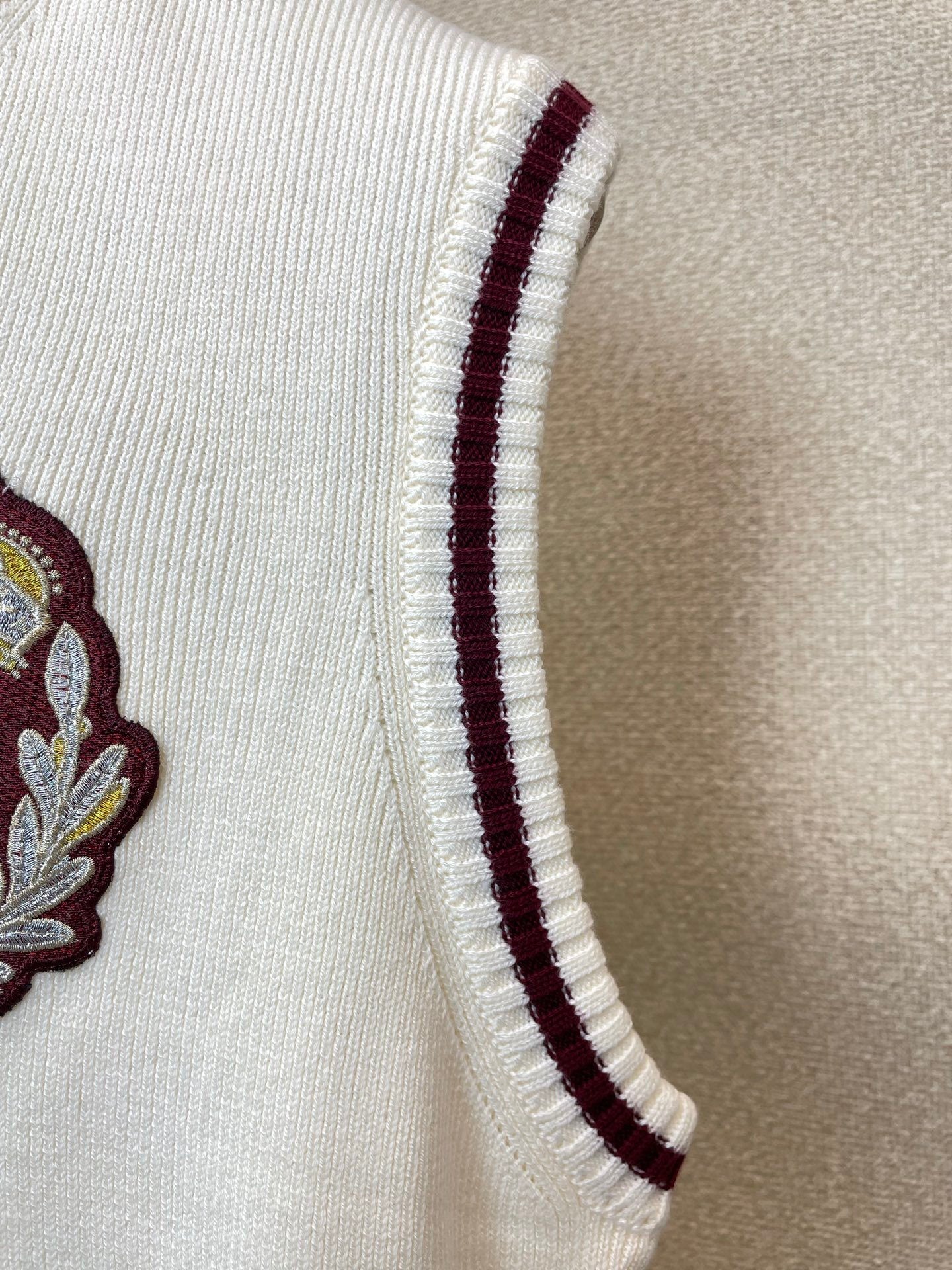 V-NECK KNIT VEST WITH EMBROIDERED CREST