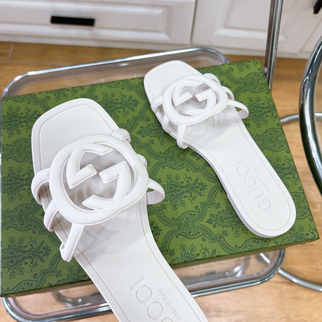 MINIMALIST WHITE SLIDES WITH STATEMENT EMBLEM