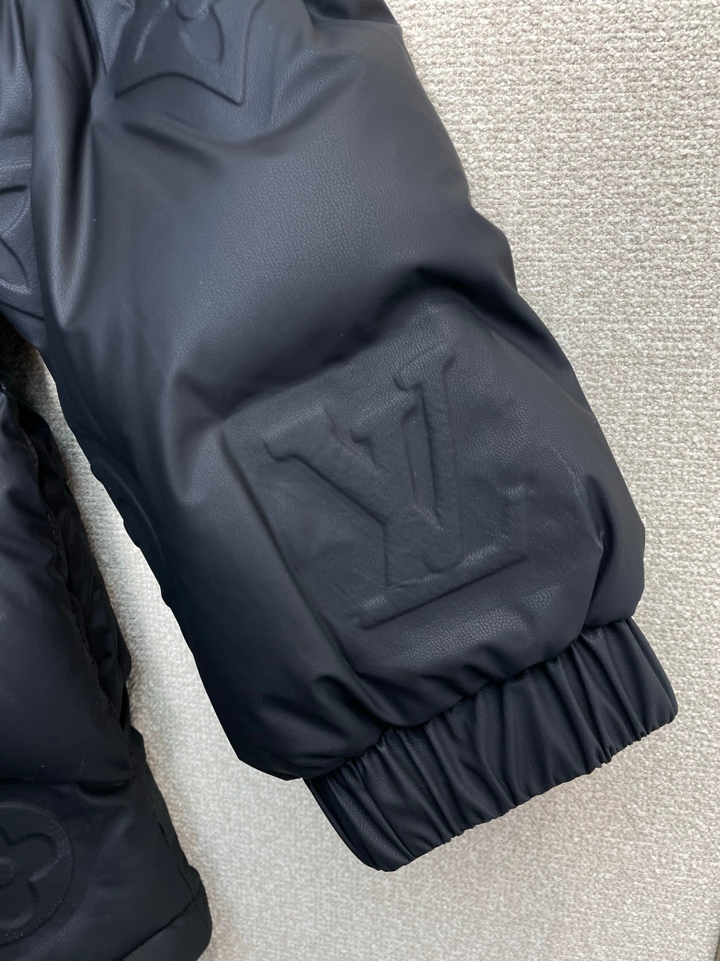 PUFFER JACKET WITH EMBOSSED GEOMETRIC PATTERN