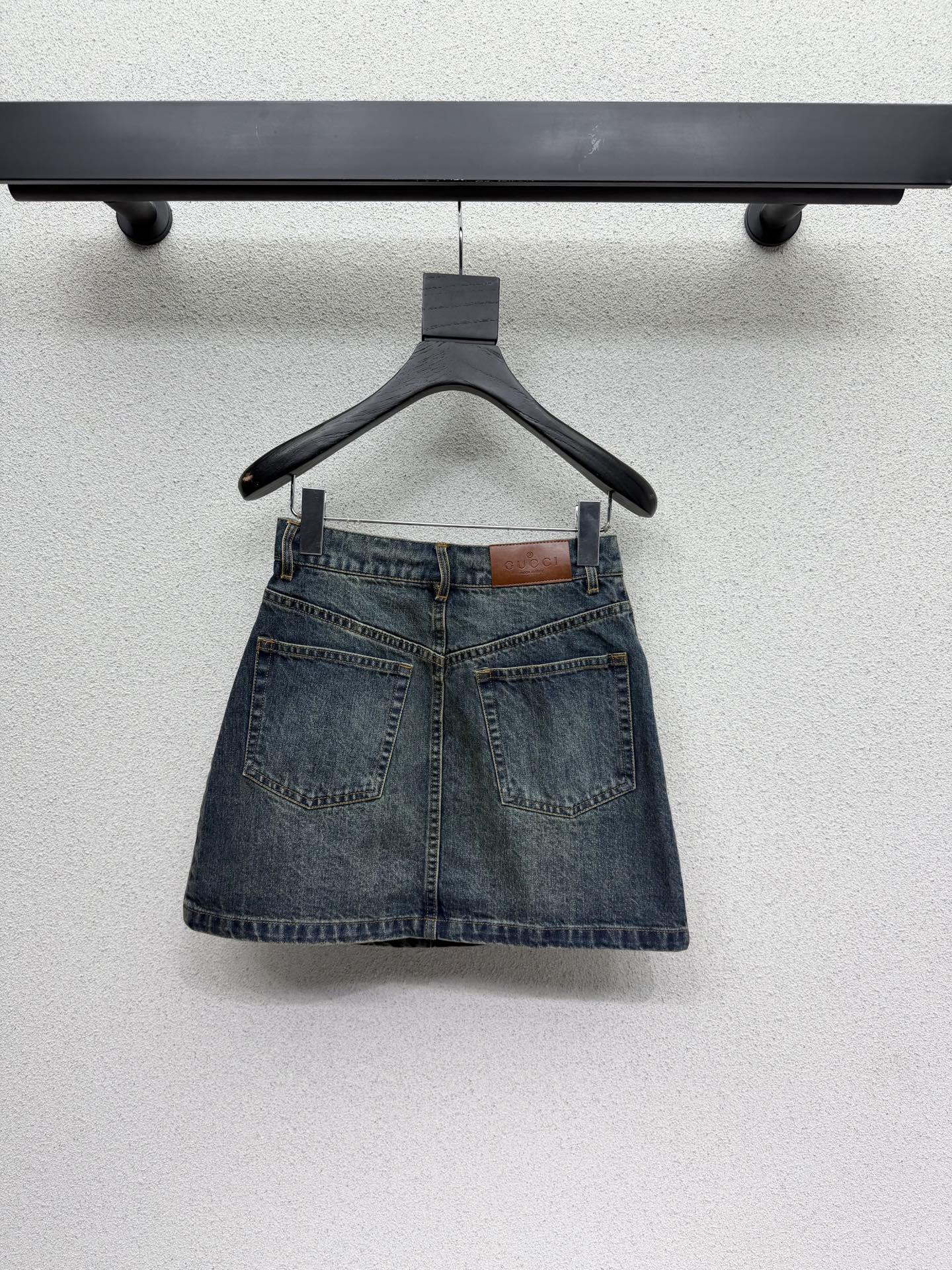 DARK BLUE DENIM MINI SKIRT WITH METAL DETAIL