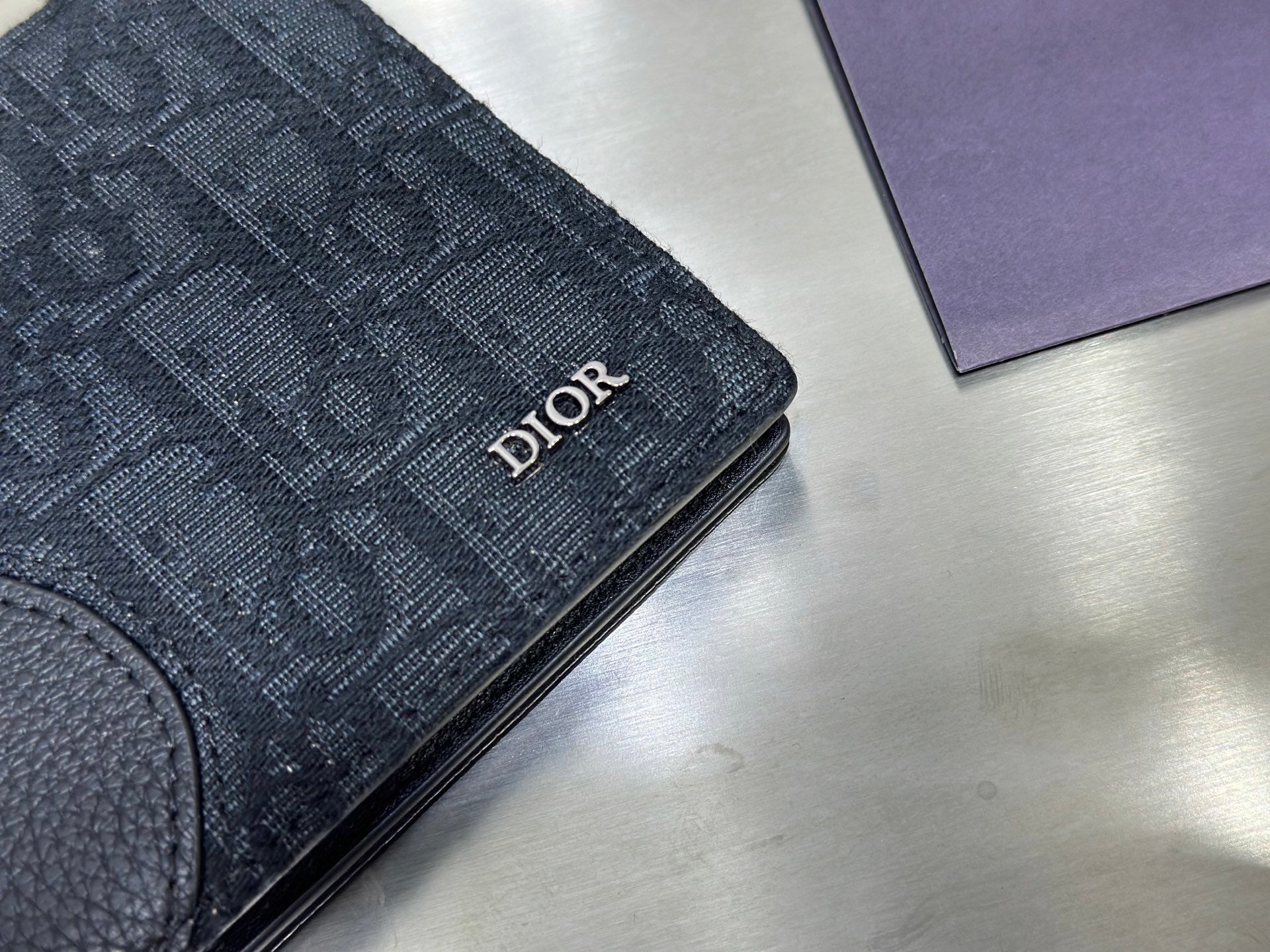 BLACK LEATHER AND CANVAS BIFOLD WALLET WITH TEXTURED MONOGRAM