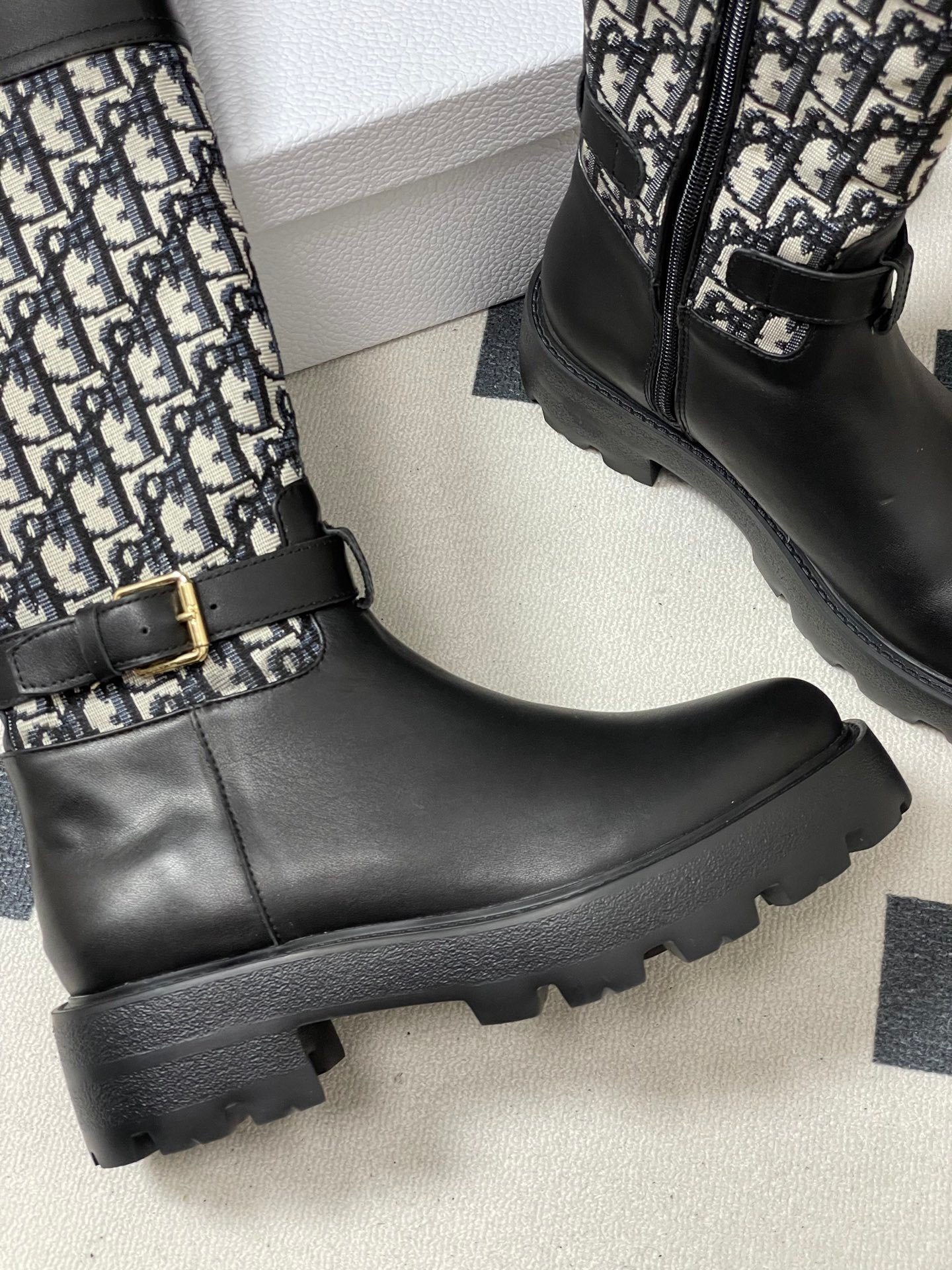 BLACK MID-CALF BOOTS WITH MONOGRAM FABRIC PANEL AND BUCKLE DETAIL