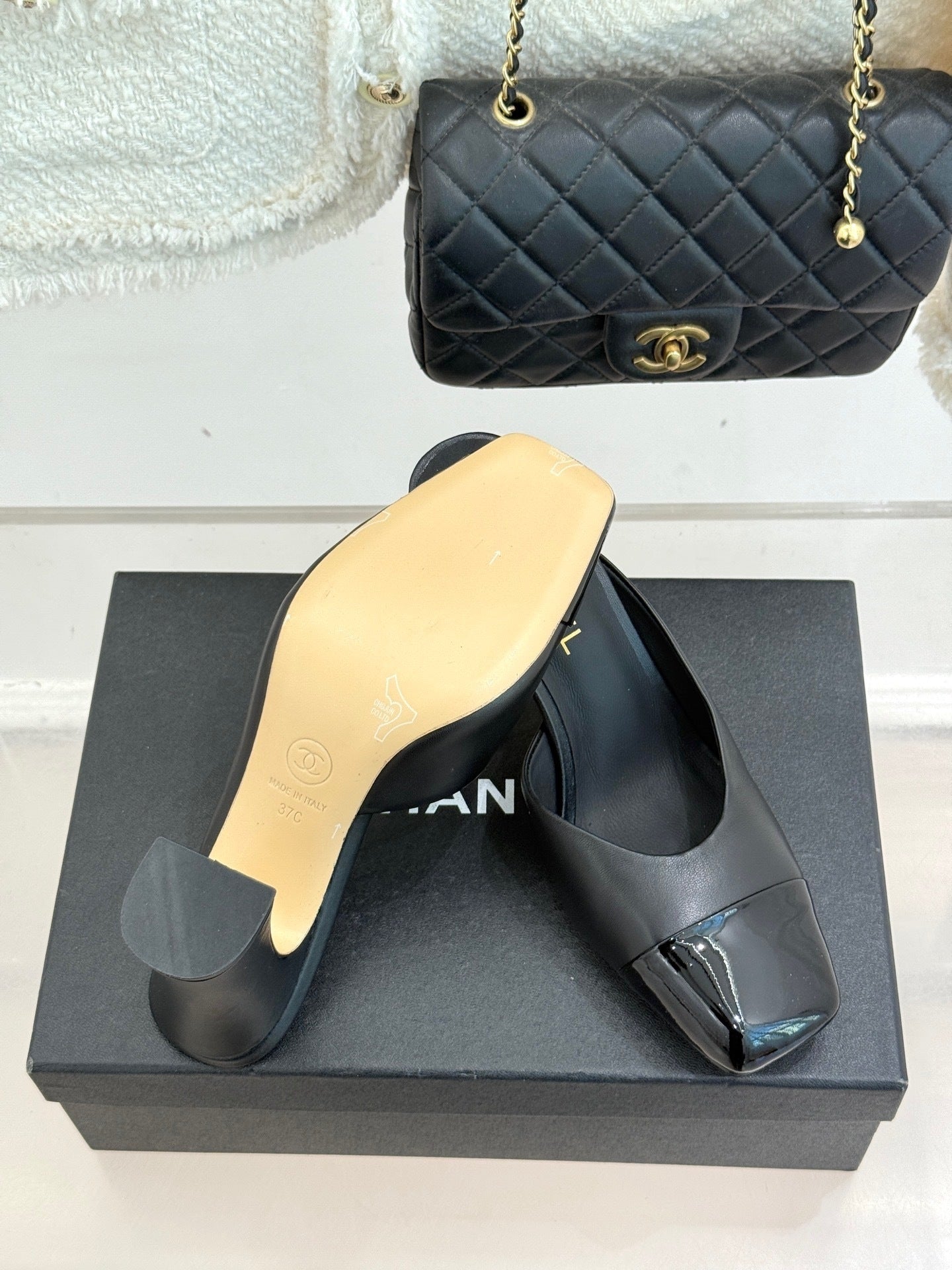 BLACK LEATHER CAP-TOE MULE HEELS WITH GOLD DETAIL