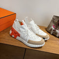 WHITE TECH-KNIT SNEAKERS WITH SUEDE TOE & ORANGE HEEL ACCENT