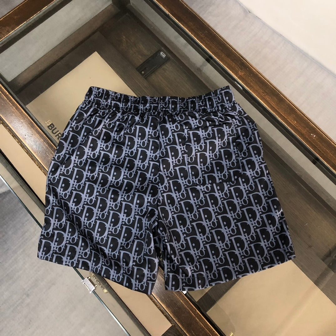 BLUE MONOGRAM PRINT SWIM SHORTS
