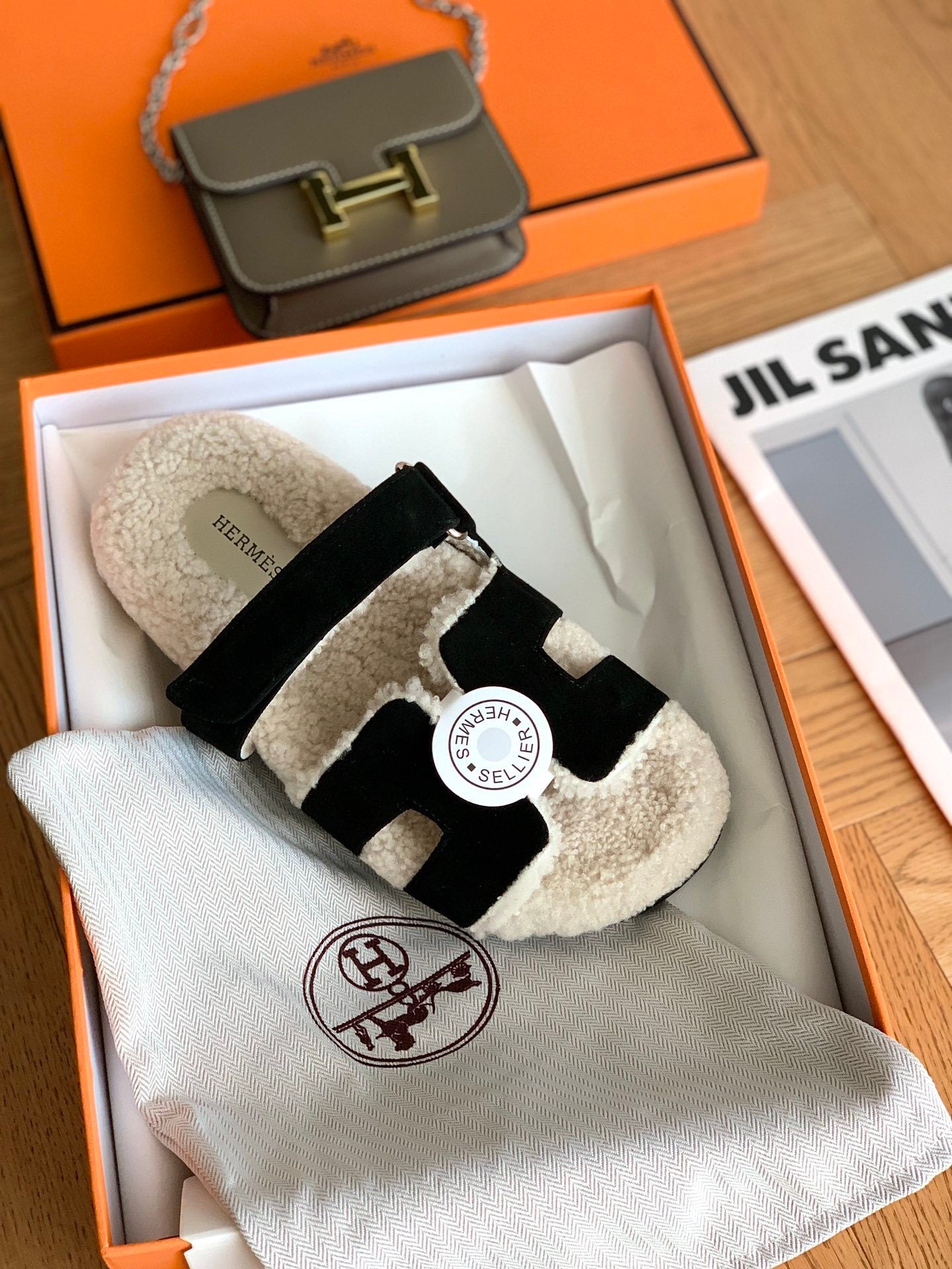 SHEARLING SLIDE SANDALS WITH BLACK STRAPS