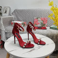 RED STRAPPY HEEL SANDALS WITH CRYSTAL EMBELLISHMENTS