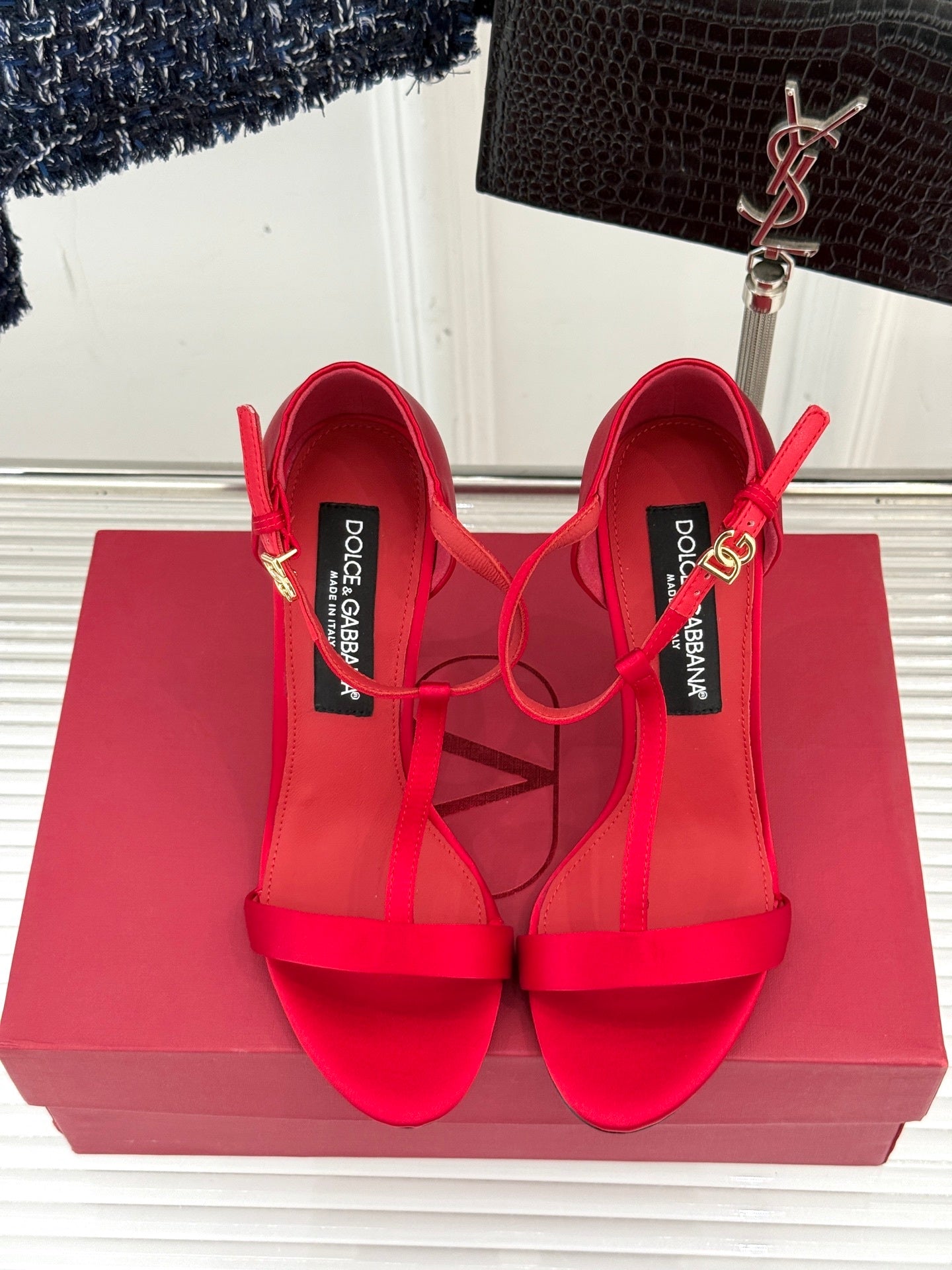 BOLD RED STRAPPY HEEL SANDALS WITH STATEMENT SILHOUETTE